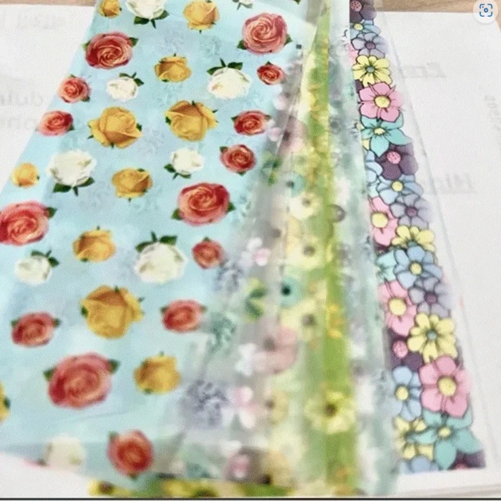 - Ten sheets of nail foils , flowers  mix